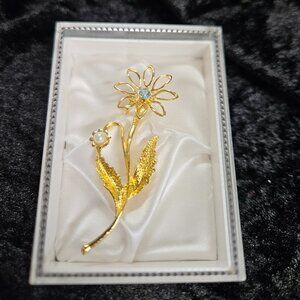 Gold Toned Flower Pin with blue accent stone in flower, and faux pearl accents